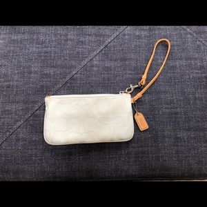 Cream colored Coach wristlet